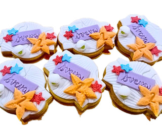 Biscotti decorati artigianali a tema stelle marine in pasta frolla e pasta di zucchero, ideali per compleanni estivi e feste a tema mare.